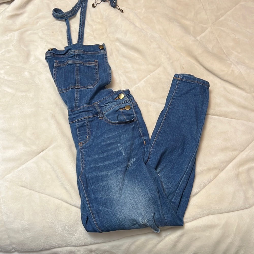 Distressed denim overalls